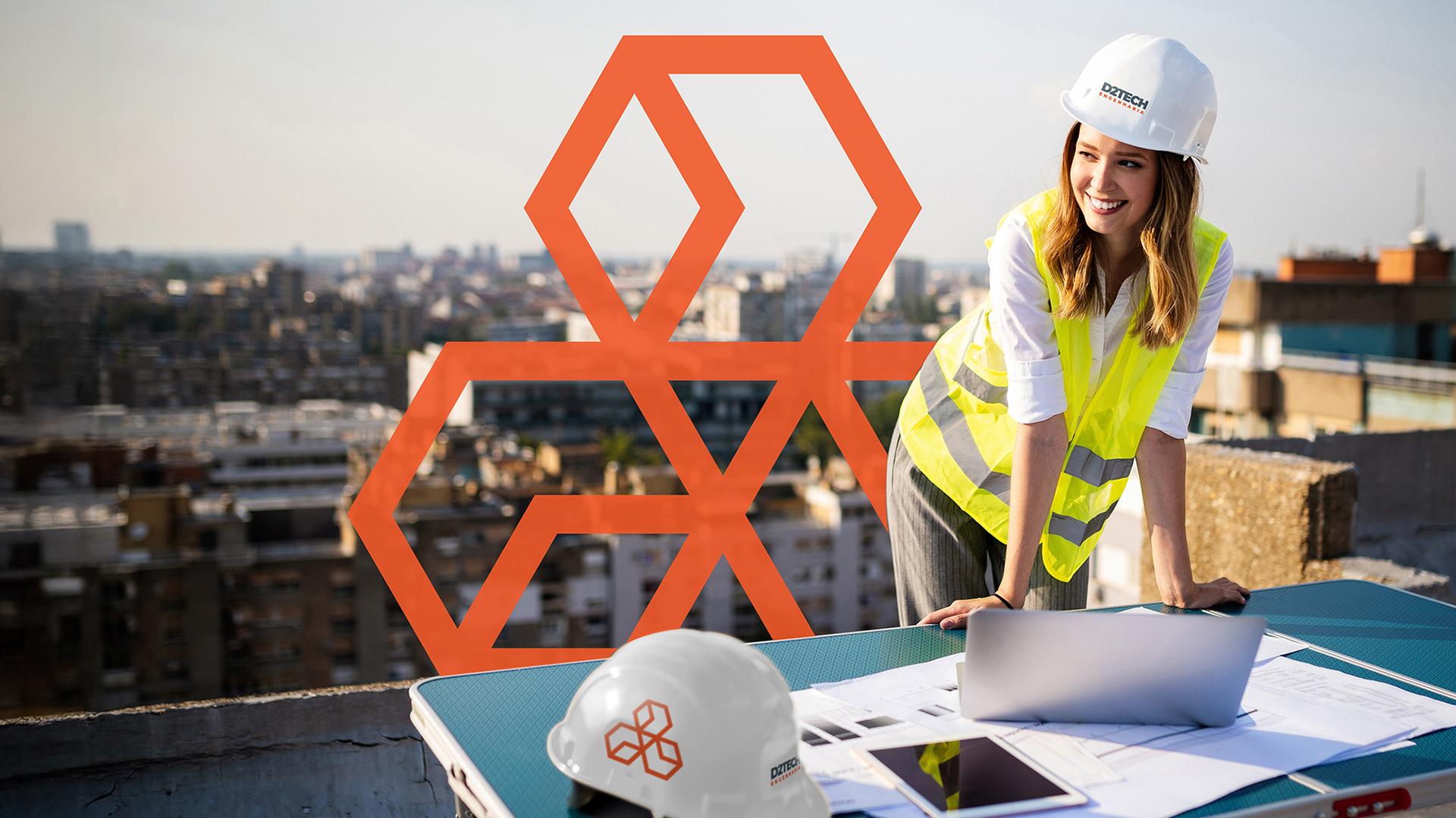 Young female construction specialist engineer reviewing blueprints at construction site